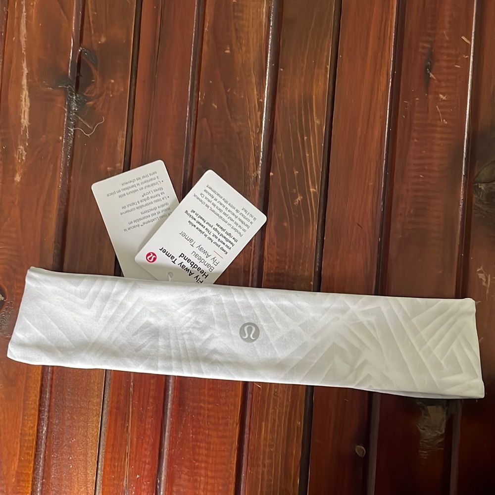 Brand new fly away tanner headband with tags from lululemon.